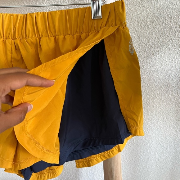 Free People Movement Run For It Mustard Yellow and Navy Shorts NWOT - Picture 6 of 10